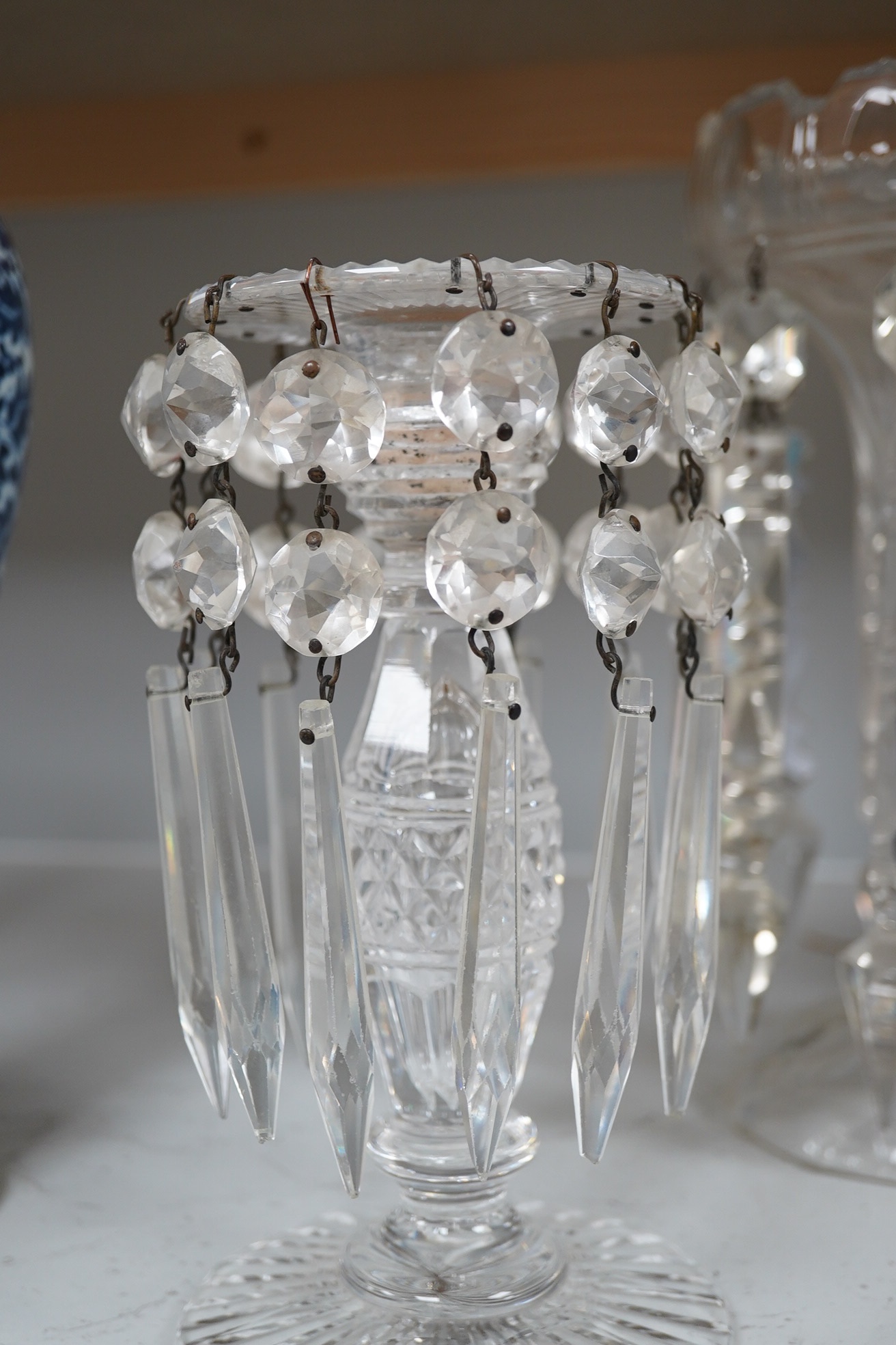 19th century and later glassware comprising, two pairs of glass lustres with drops, a single lustre and a collection of coloured twist stirrers, largest 29cm high. Condition - fair to good